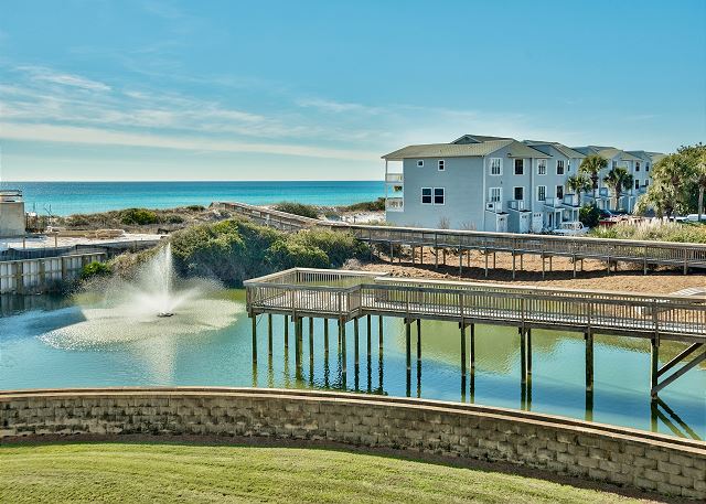 exterior of san remo condo complex with views of the boardwalk and fountain